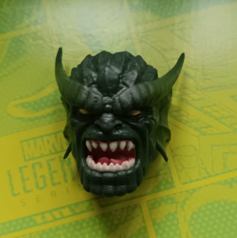 Close‑up of Abomination’s modern gameverse‑style head with mutated horned brows.